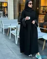 Used long brown women's abaya size XXL with hijab and small handbag.