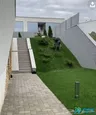 Used residential villa with a front garden and external staircase.