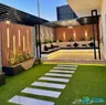 Used residential villa with a front garden and external staircase.