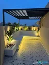 Used residential villa with a front garden and external staircase.