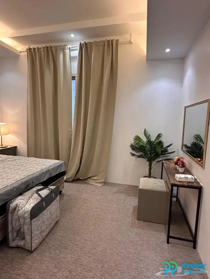New furnished apartment in Al Khobar, Al Hamra district, with a city view, parking, and an electric elevator.