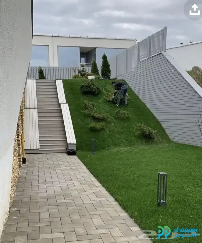 Used residential villa with a front garden and external staircase.